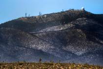 The forest ridge is burned below the Angel Peak FAA Radar Site during the Mahogany Fire on Moun ...