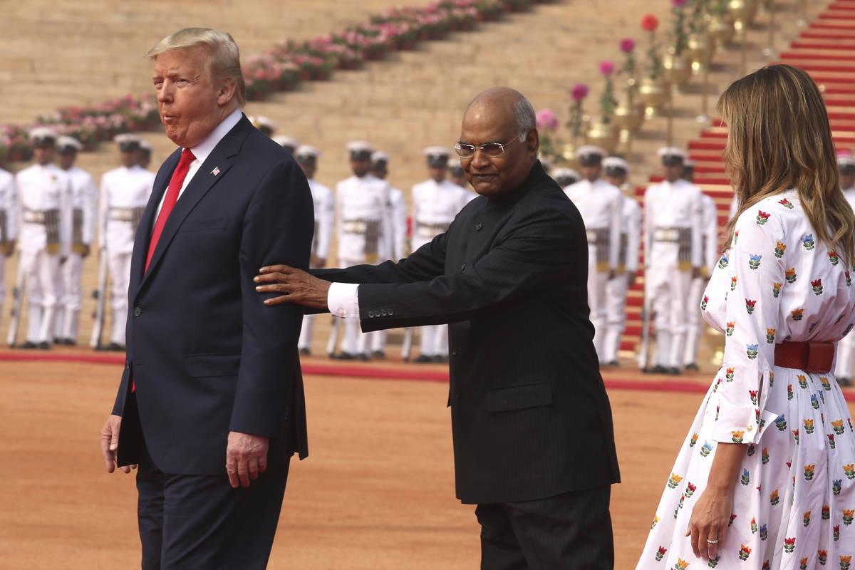 FILE - In this Feb. 25, 2020, file photo, Indian President Ram Nath Kovind, center, holds the a ...