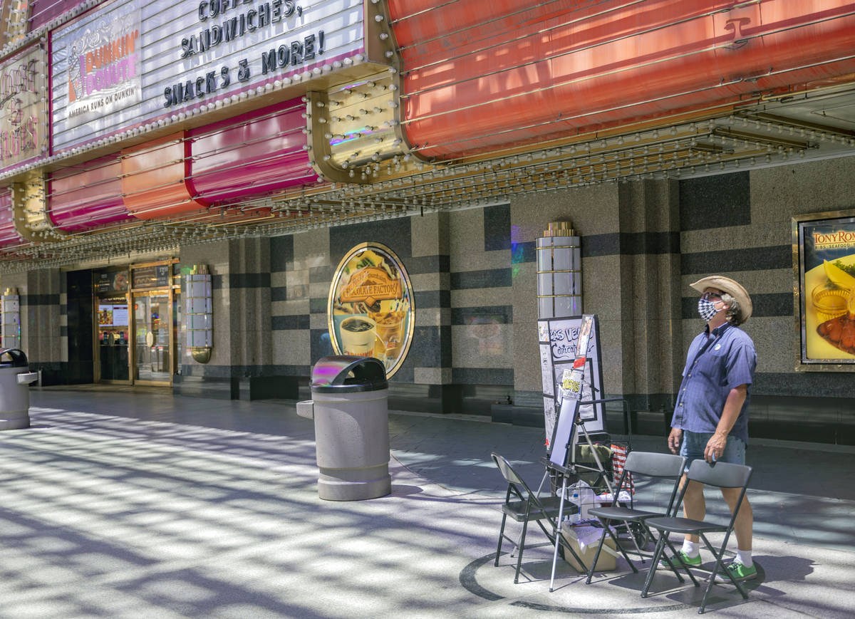 Mike Warden of Las Vegas Caricatures waits by his outdoor drawing space in the Fremont Street E ...