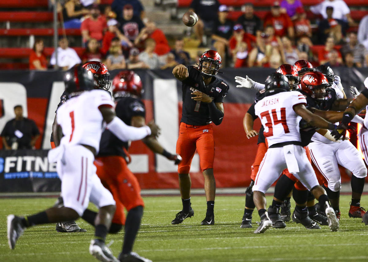 UNLV Rebels quarterback Armani Rogers (1) throws a pass during the first half of an NCAA footba ...
