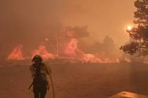 Ad of 9:30 p.m., Monday, July 6, fire was burning on both sides of U.S. Highway 395, south of G ...