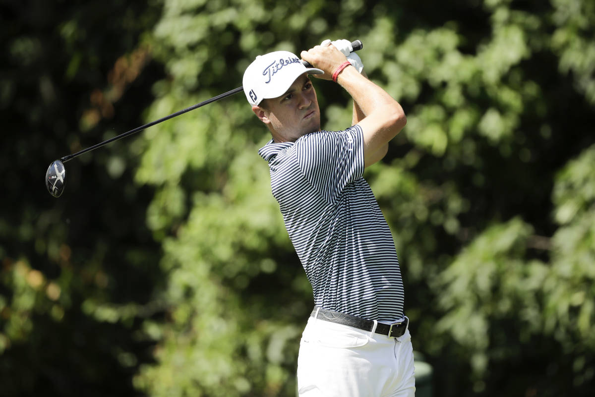 Justin Thomas tees off on the 12th hole during the first round of the Travelers Championship go ...