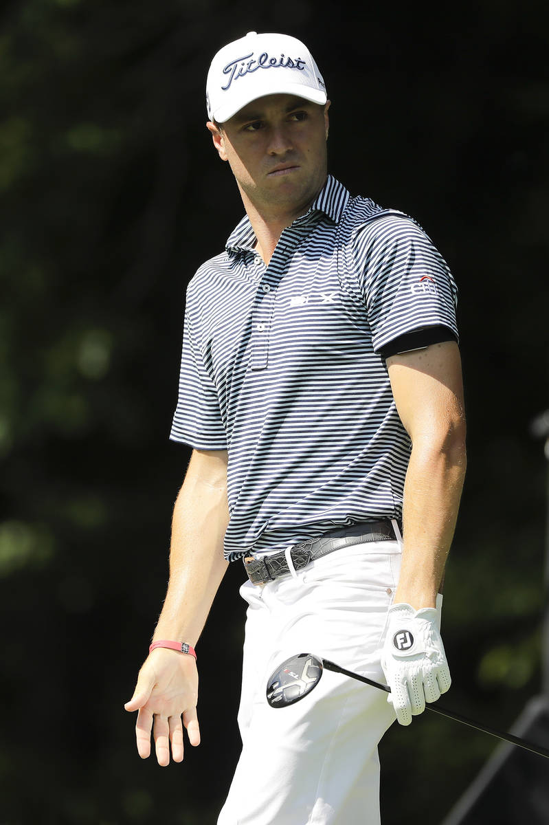 Justin Thomas looks at his tee shot on the 12th hole during the first round of the Travelers Ch ...