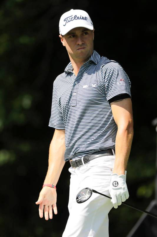 Justin Thomas looks at his tee shot on the 12th hole during the first round of the Travelers Ch ...