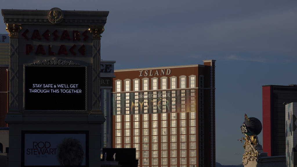 The sun sets on the Strip, including Caesar's Palace and Treasure Island on Tuesday, March 24, ...