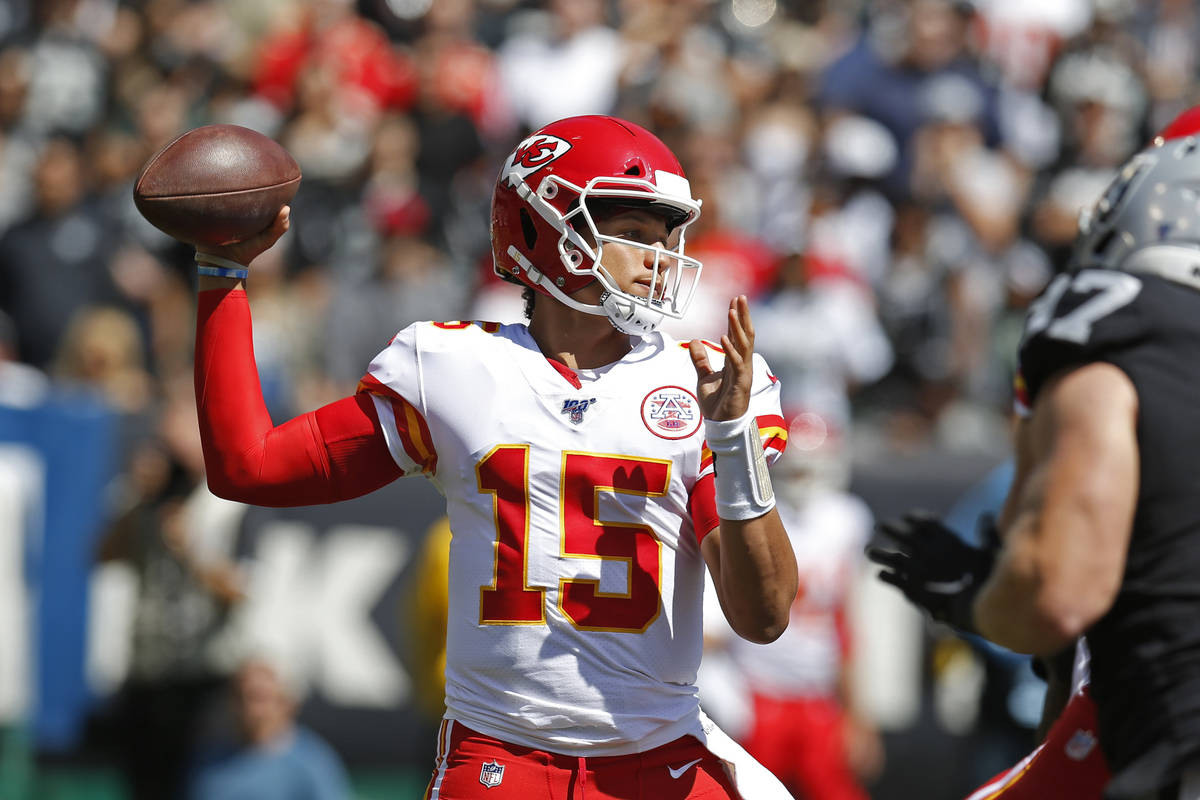Kansas City Chiefs quarterback Patrick Mahomes looks to throw the ball during the first half of ...