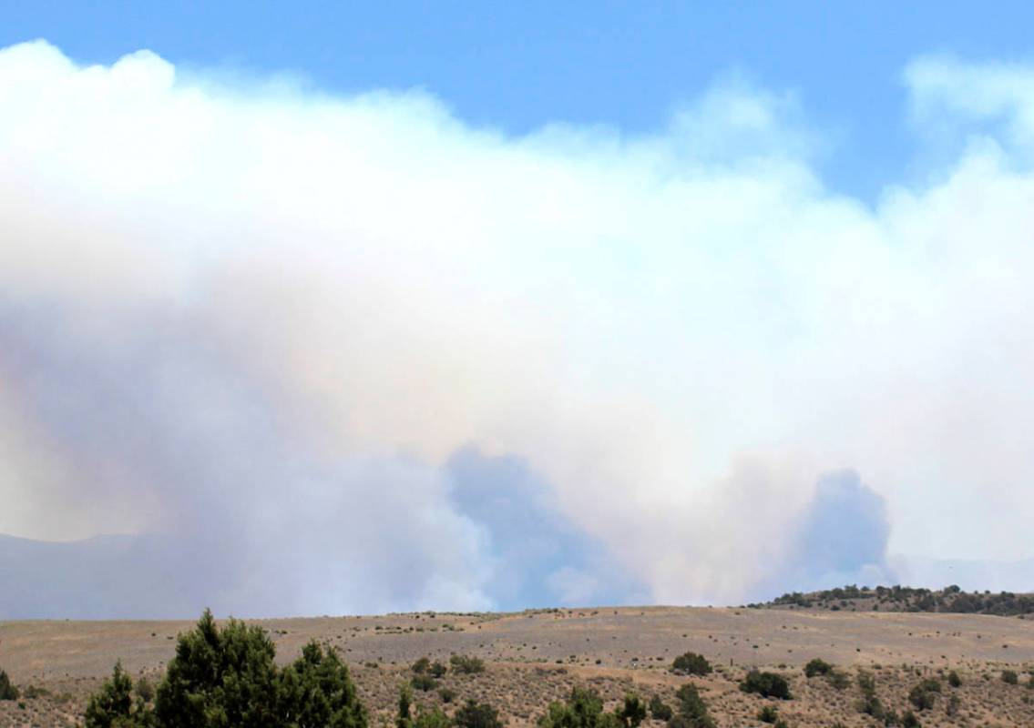 Smoke rises from the Numbers Fire burning east of Gardnerville, Nev., on Tuesday, July 7, 2020. ...