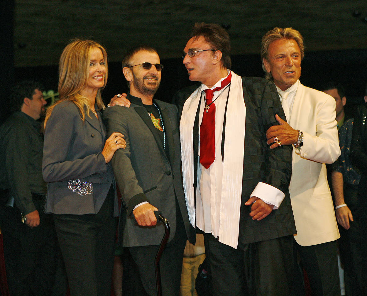 Ringo Starr and his wife Barbara Bach pose for photos with Siegfried and Roy during arrivals at ...