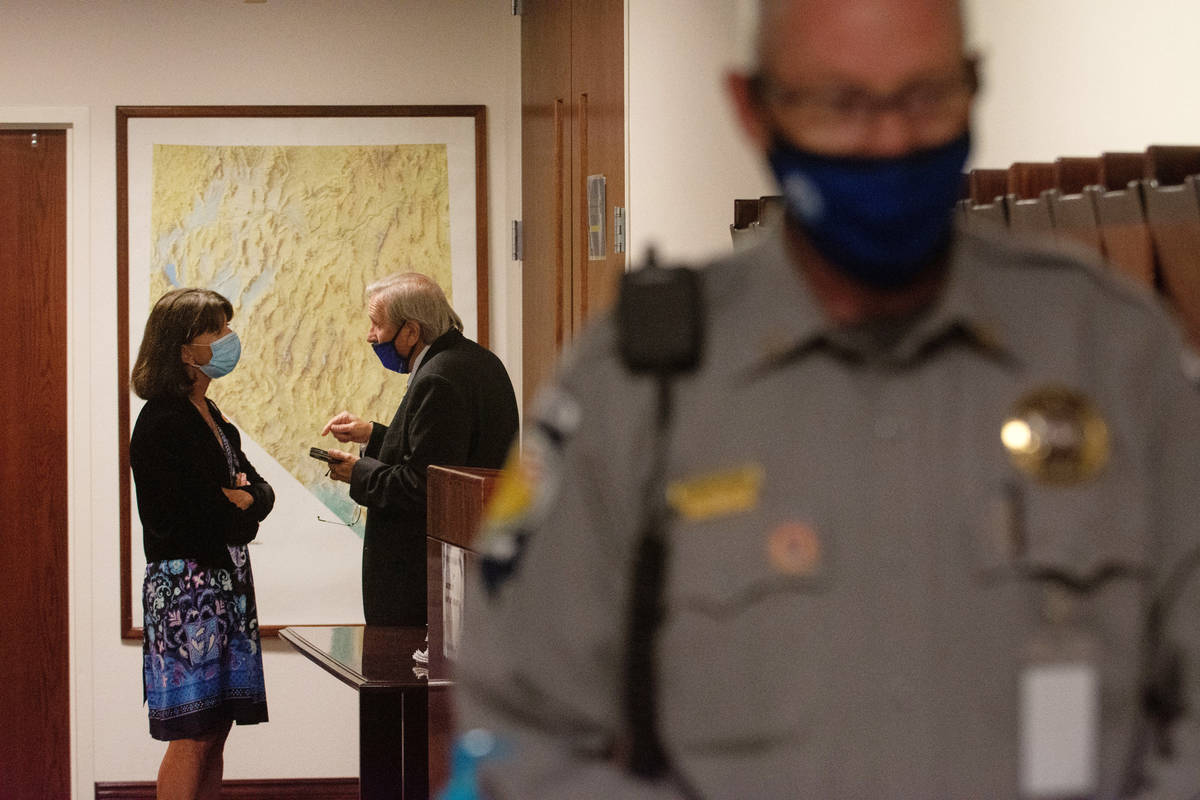 A Nevada Assemblywoman Robin Titus speaks with Assemblyman John Ellison during a recess on the ...