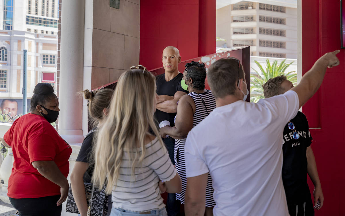 Tourist look at a wax figure of actor Vin Diesel in front of Madame Tussauds Las Vegas wax muse ...