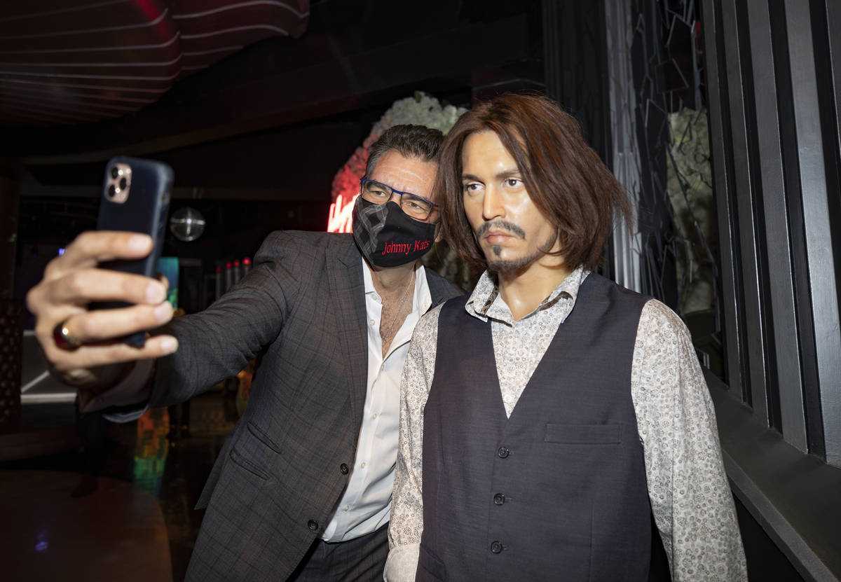 John Katsilometes takes a selfie with actor Johnny Depp's wax figure during a tour of Madame Tu ...