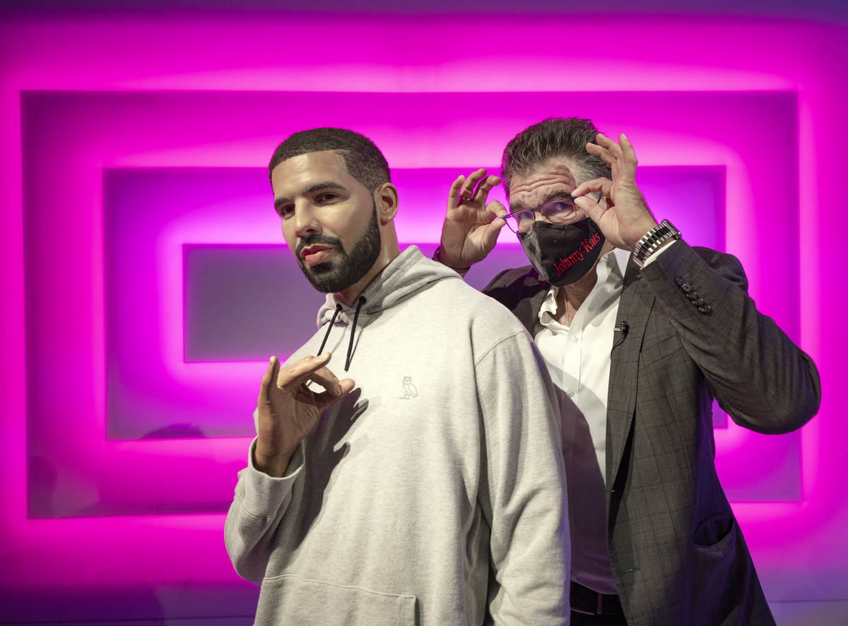 John Katsilometes poses with the wax figure of Drake while giving a tour of Madame Tussauds Las ...
