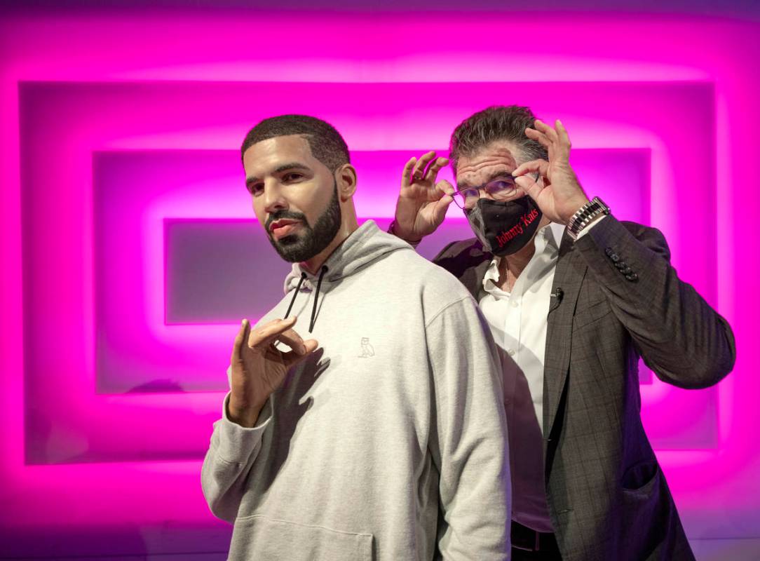 John Katsilometes poses with the wax figure of Drake while giving a tour of Madame Tussauds Las ...