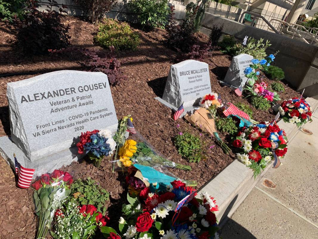 This photo shows the memorial markers for the three VA employees who died of COVID-19. The mark ...