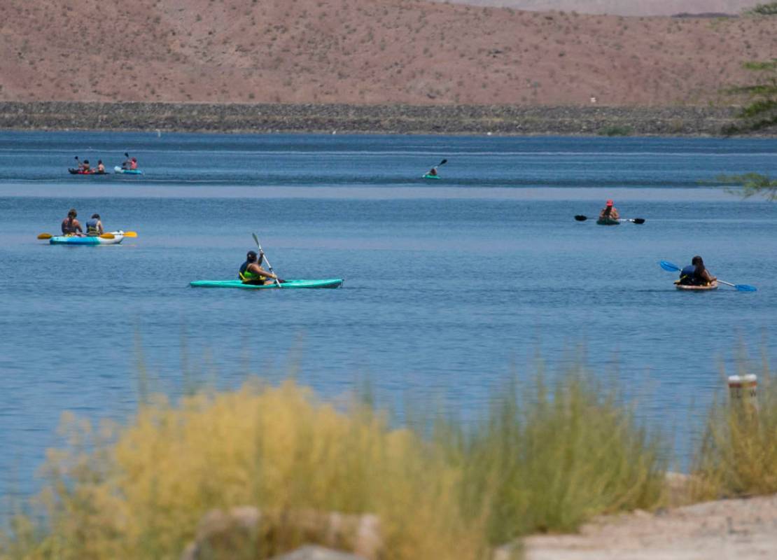 People enjoy paddle boarding at Lake Las Vegas on Monday, July 6, 2020, in Henderson. A dangero ...