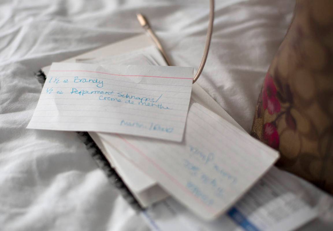 Drink flashcards sit on Alexis Cossman's bed following her bartending shift at Red Lobster on W ...