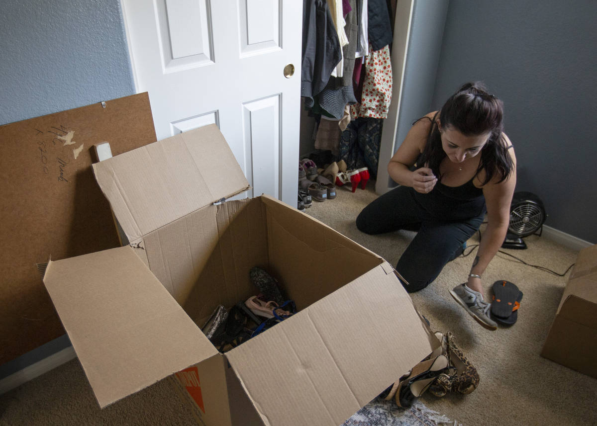 Alexis Cossman unpacks her last box as she moves into her roommate's newly purchased home on We ...