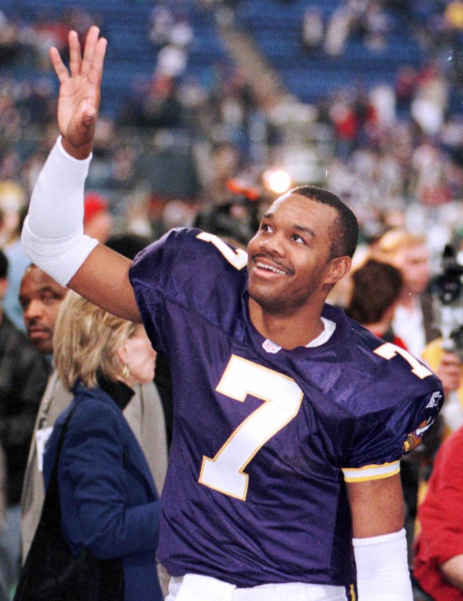 Minnesota Vikings quarterback Randall Cunningham waves to someone in the crowd after their 41-2 ...