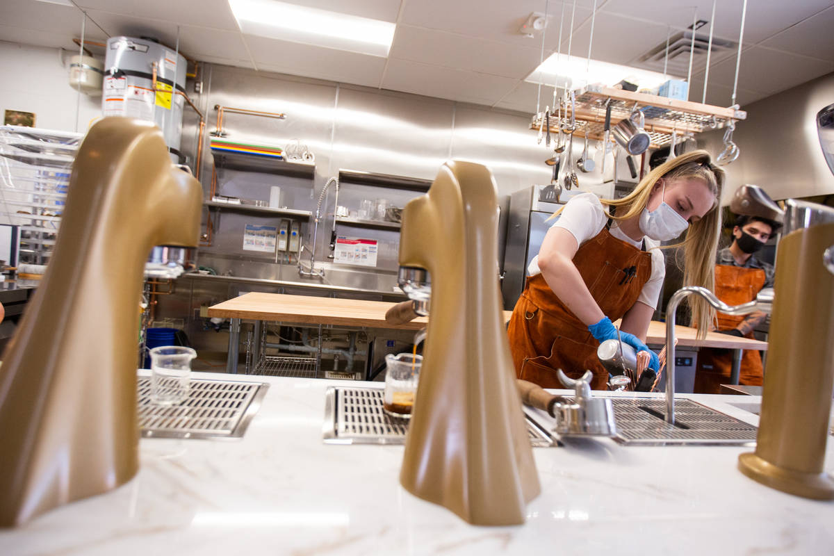 Paris Cesena, the lead roaster at Take It Easy, prepares a drink in Las Vegas on Friday, July 1 ...