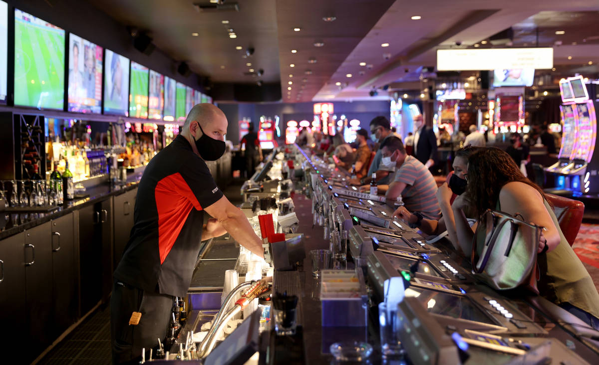 Steve, who declined to give his last name, serves drinks at Longbar at D Las Vegas Friday, July ...