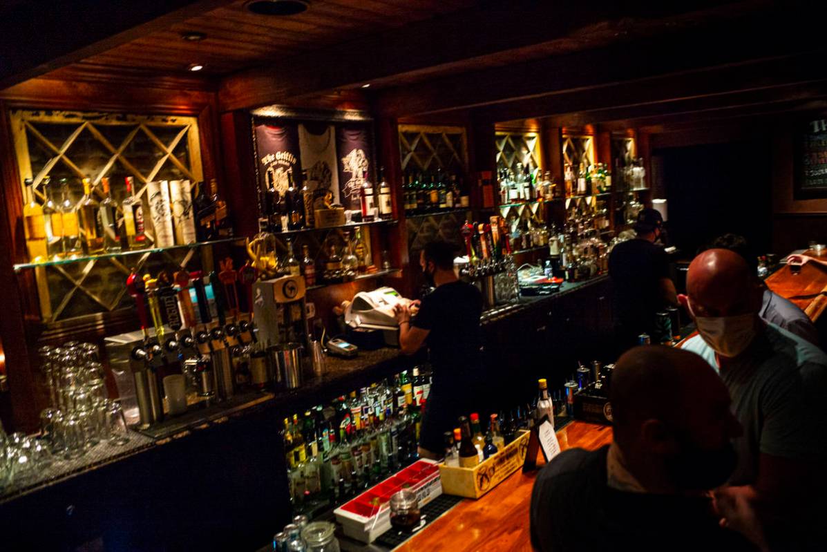 Nicky Cianella prepares drinks just before last call at The Griffin on Fremont Street in downto ...