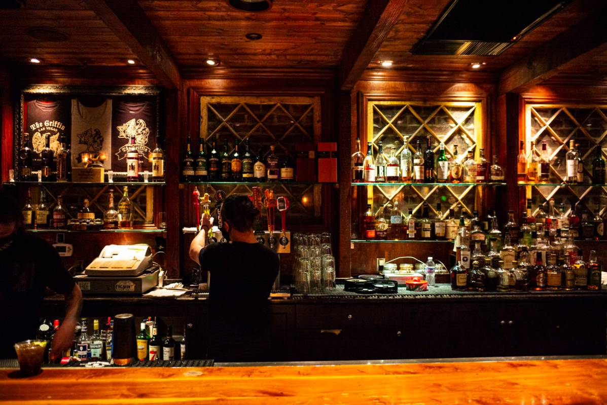 Nicky Cianella prepares drinks just before last call at The Griffin on Fremont Street in downto ...