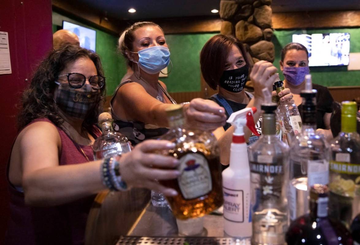 Owner Robin Slipock, left, Angel Stern and Jamie Stewart-Poyser break down the bar after last c ...