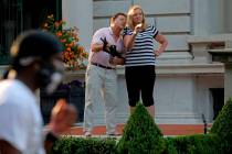 FILE - In this June 28, 2020 file photo, armed homeowners Mark and Patricia McCloskey, standing ...
