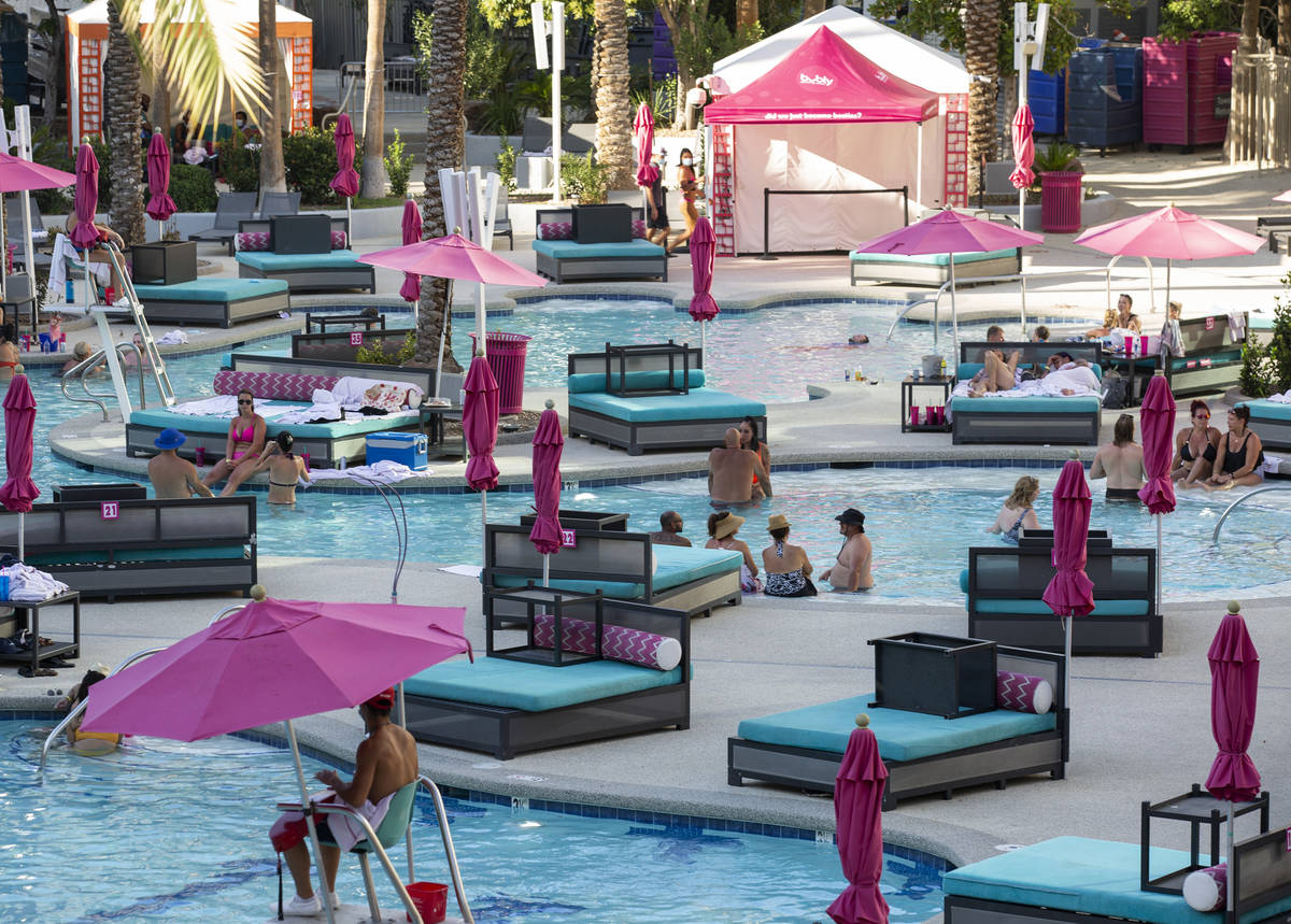 Guests cool off from the 113-degree heat at Flamingo Las Vegas on Sunday, July 12, 2020, on the ...