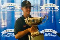 Michael Sarro celebrates with the trophy after winning the Nevada State Amateur Championship on ...