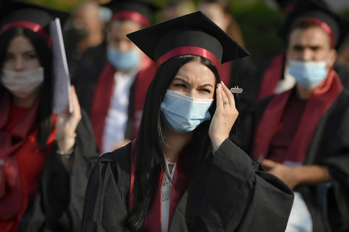 Students of the the Polytechnic Institute wear face masks during the graduation ceremony for th ...