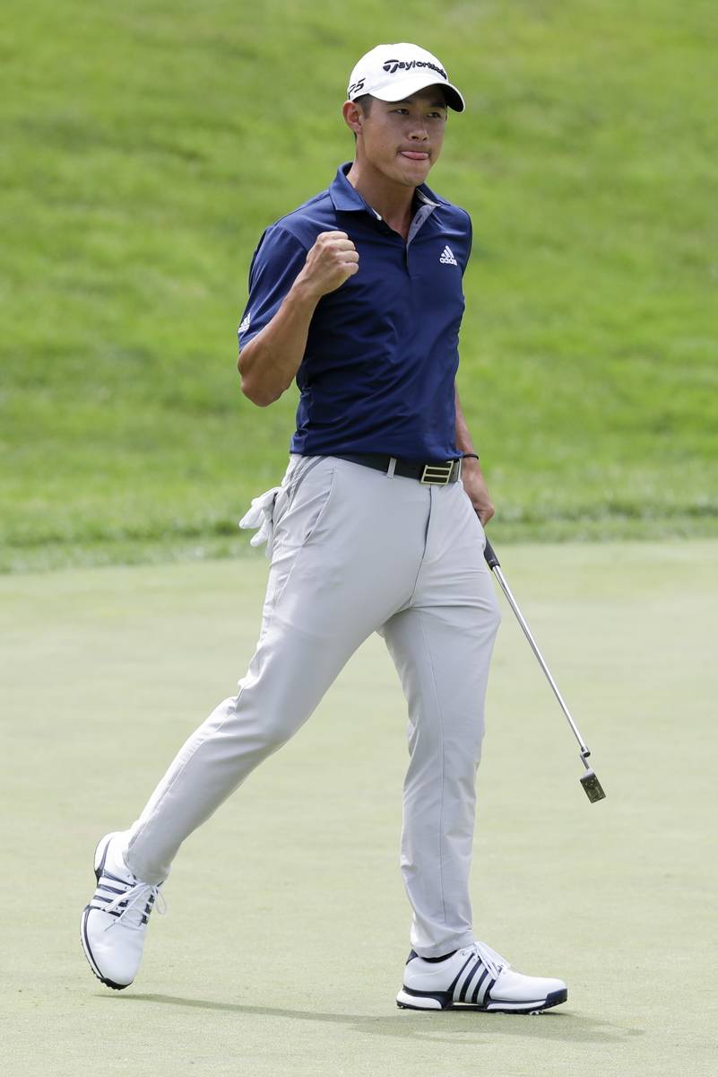 Collin Morikawa reacts to a putt on the first playoff hole during the final round of the Workda ...