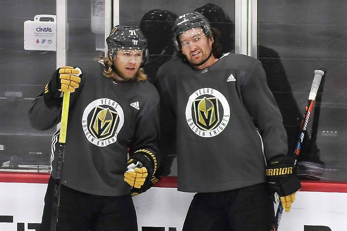 Vegas Golden Knights center William Karlsson (71), left, talks with right wing Mark Stone (61) ...