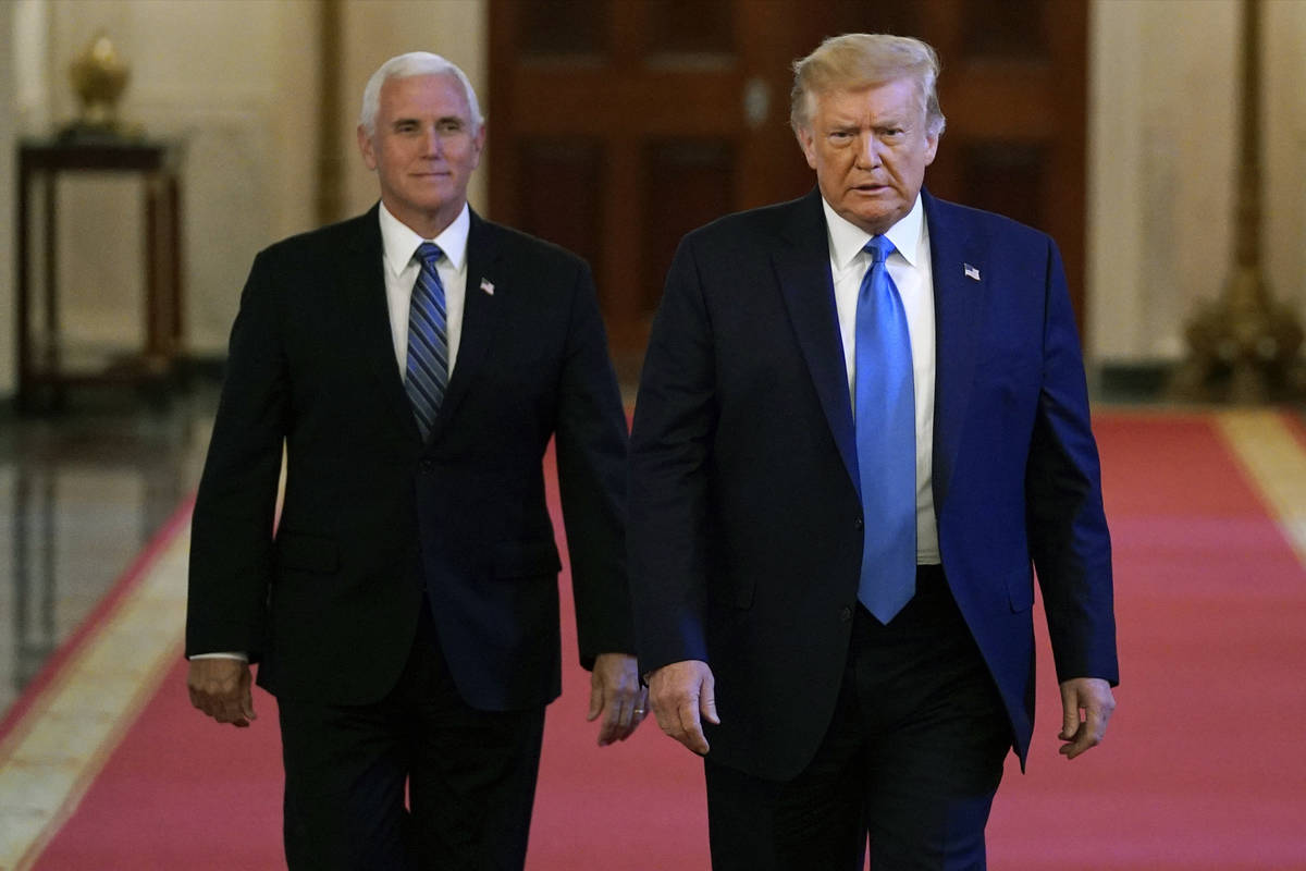 President Donald Trump and Vice President Mike Pence arrive to speak at a roundtable with peopl ...