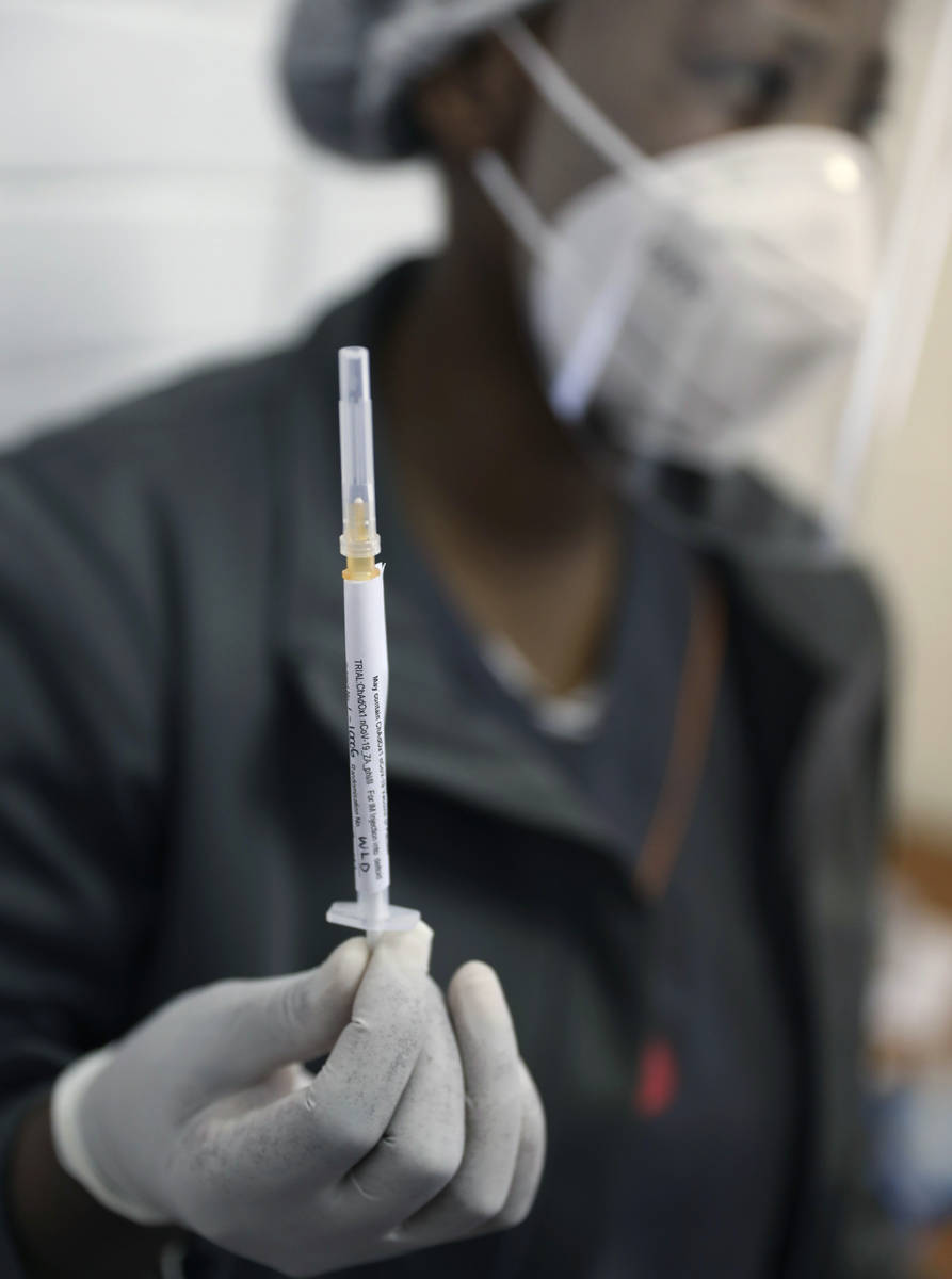 FILE - In this Wednesday, June 24, 2020 file photo, medical staff member prepares a syringe, a ...