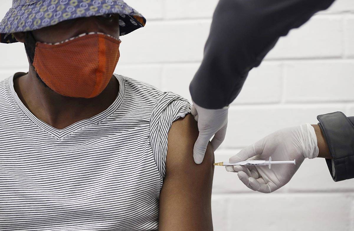 In a Wednesday, June 24, 2020, file photo, a volunteer receives a COVID-19 test vaccine injecti ...