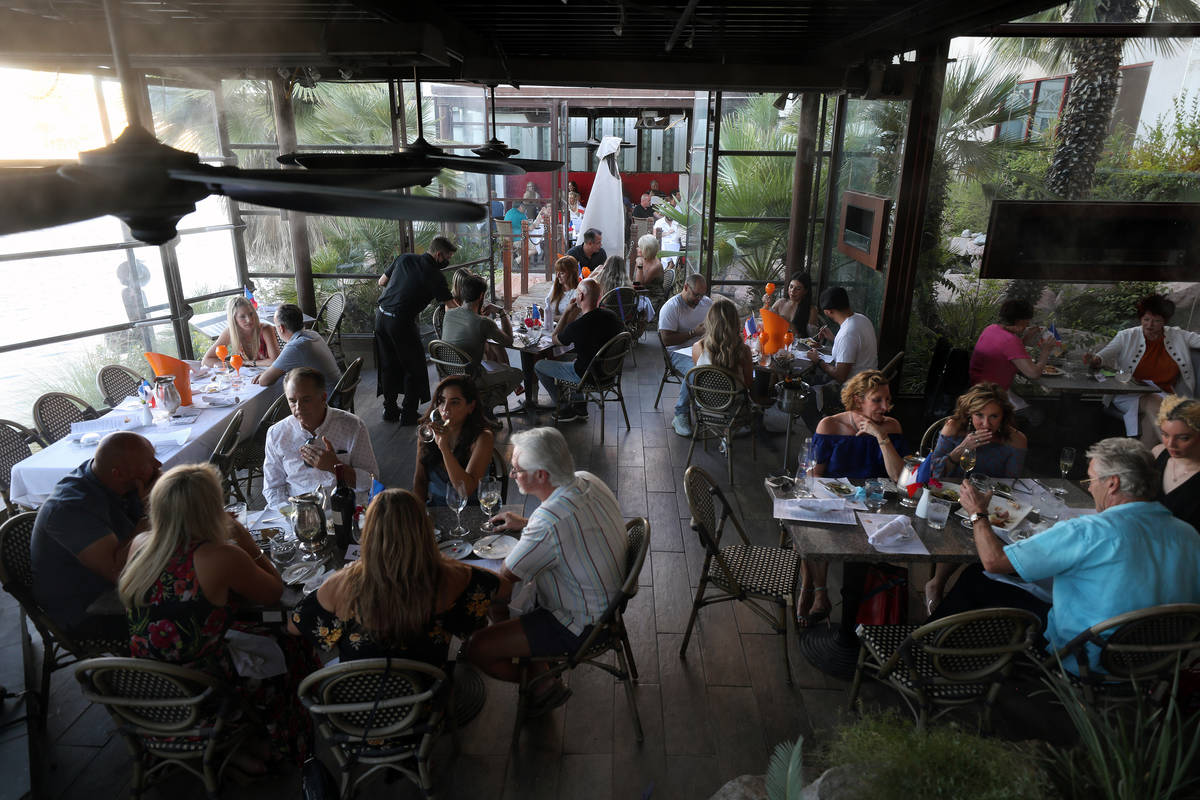 Guests dine at Marché Bacchus for their Bastille Day celebration, in Las Vegas on Tuesday, Jul ...