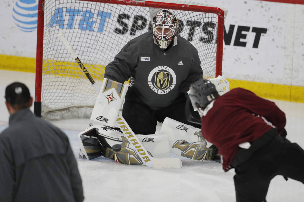 Vegas Golden Knights goaltender Robin Lehner (90) makes a save during NHL hockey training camp, ...