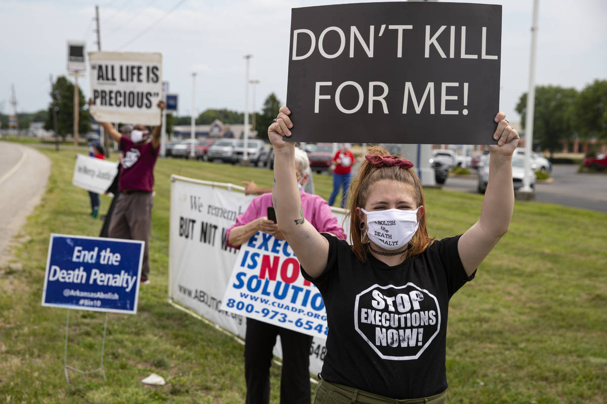 Protesters against the death penalty gather in Terre Haute, Ind., Wednesday, July 15, 2020. Wes ...