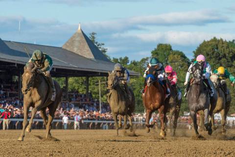Code of Honor, left, with jockey John Velazquez, leads the field to the finish line to win the ...