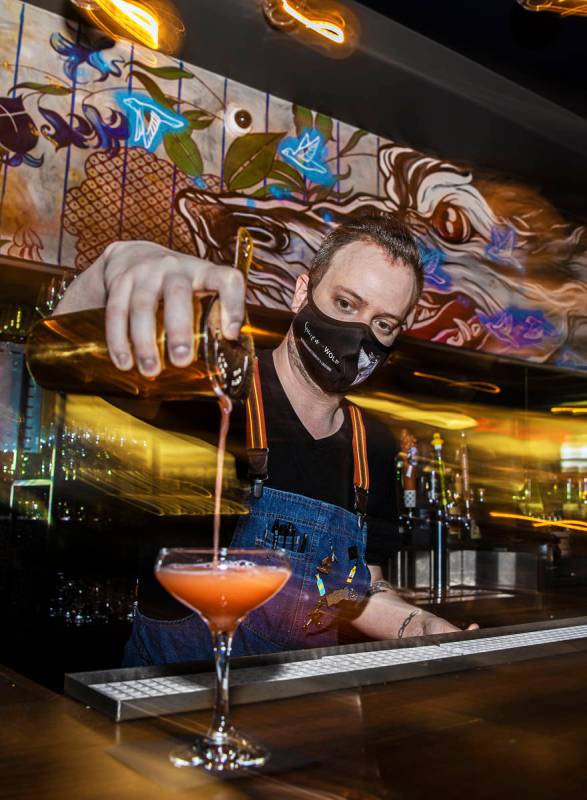 Bartender Ilan Miller makes a cocktail at Sparrow + Wolf on Tuesday, July 14, 2020, in Las Vega ...