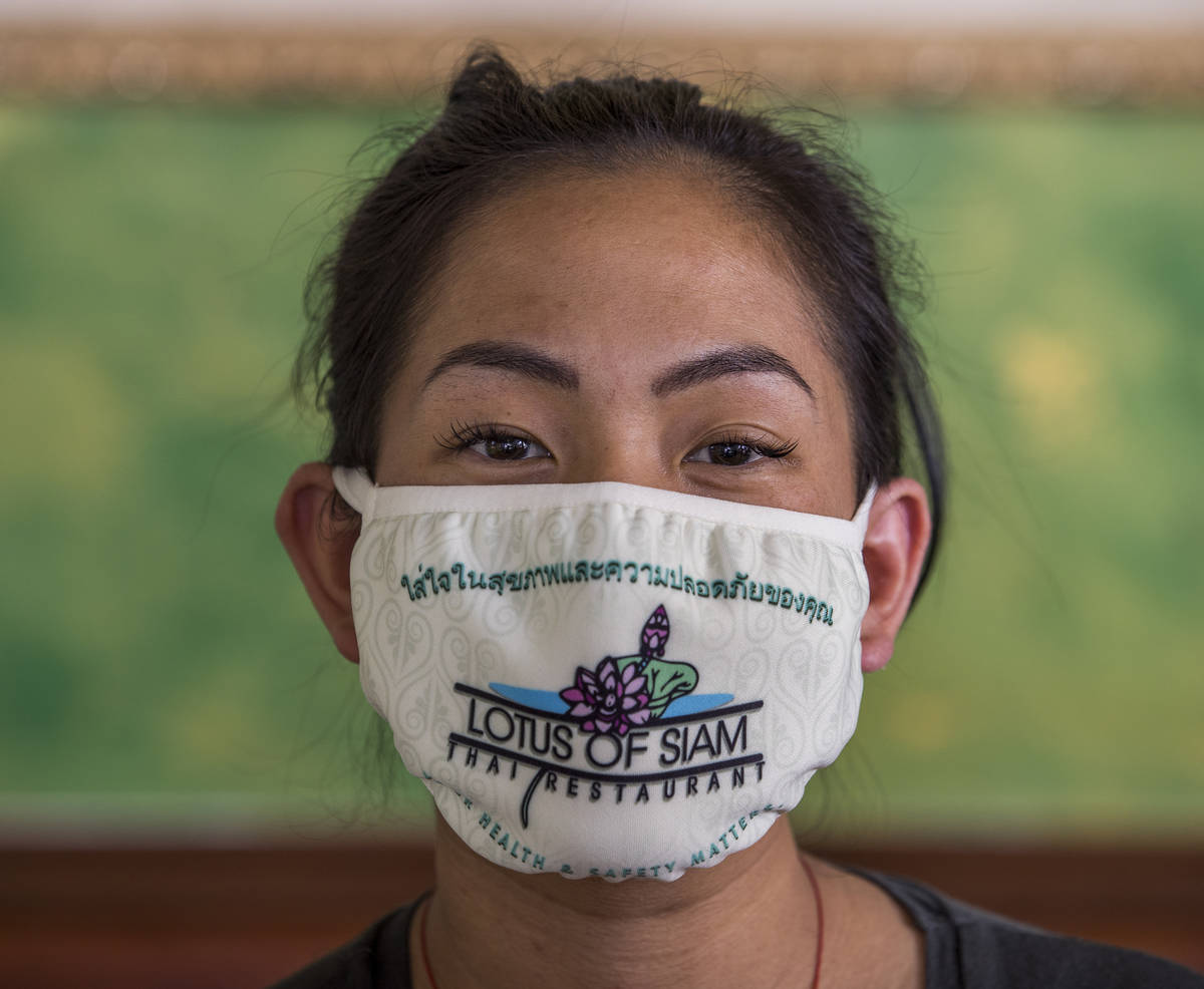 Penny Chutima at Lotus of Siam with custom mask on Wednesday, July 15, 2020, in Las Vegas. (L. ...