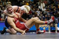 In this Jan. 2, 2019, file photo, Penn State's Bo Nickal, rear left, wrestles with Stanford's N ...