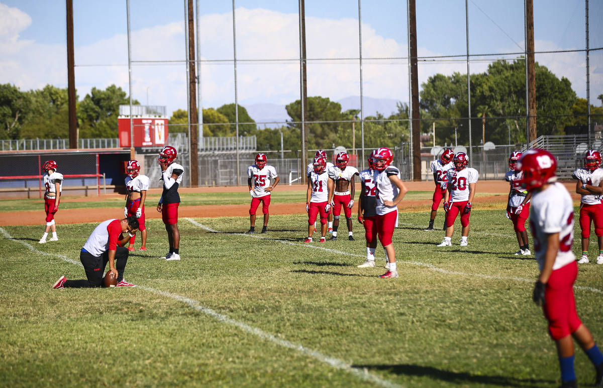 Players during footballl practice at the baseball field at Valley High School in Las Vegas on W ...