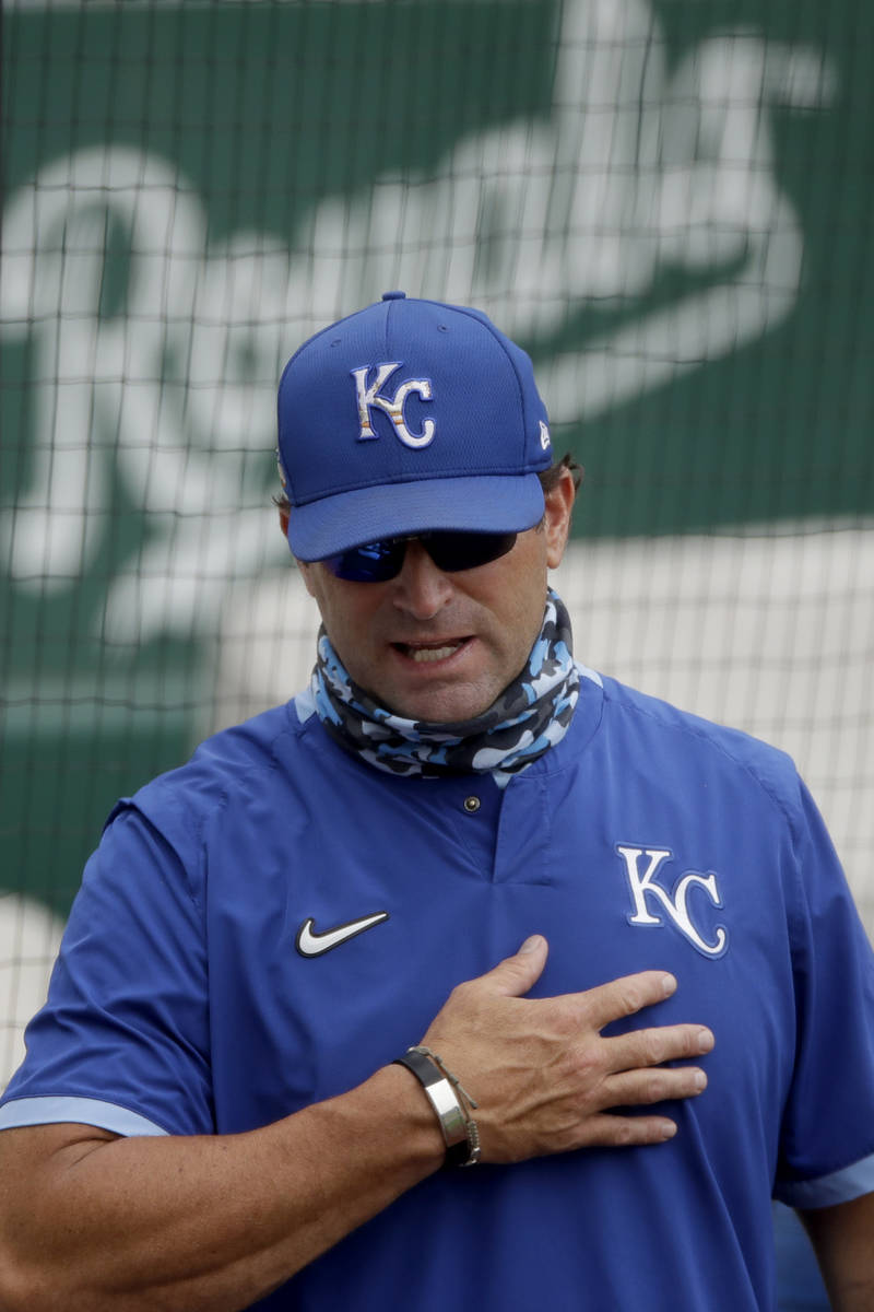 Kansas City Royals manager MIke Matheny talks to players during baseball practice at Kauffman S ...