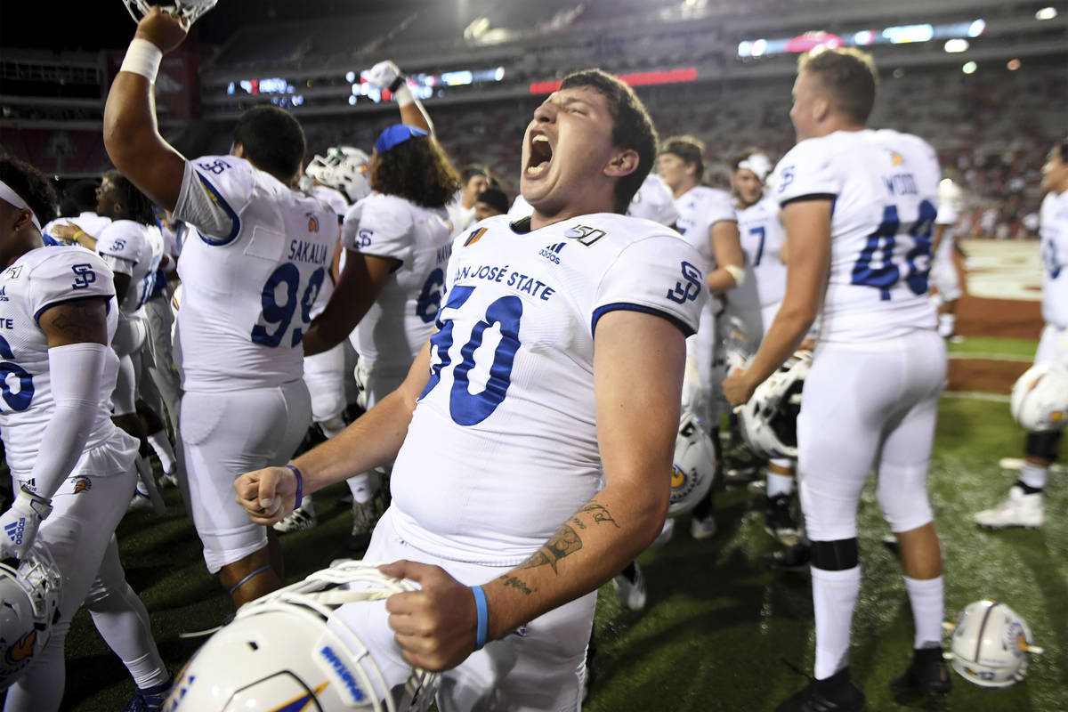 San Jose State's Will Butler celebrates with teammates after they defeated Arkansas 31-24 durin ...