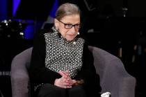 In a Dec. 17, 2019, file photo Supreme Court Justice Ruth Bader Ginsburg speaks with author Jef ...