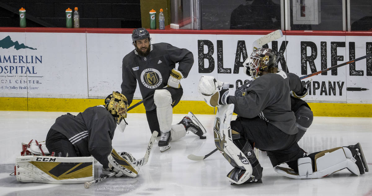 (From left) Vegas Golden Knights goaltender Marc-Andre Fleury (29), stretches with defenseman D ...