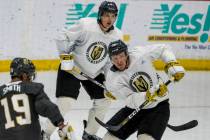 Vegas Golden Knights forward Patrick Brown (38), right, sends the puck up the ice between defen ...