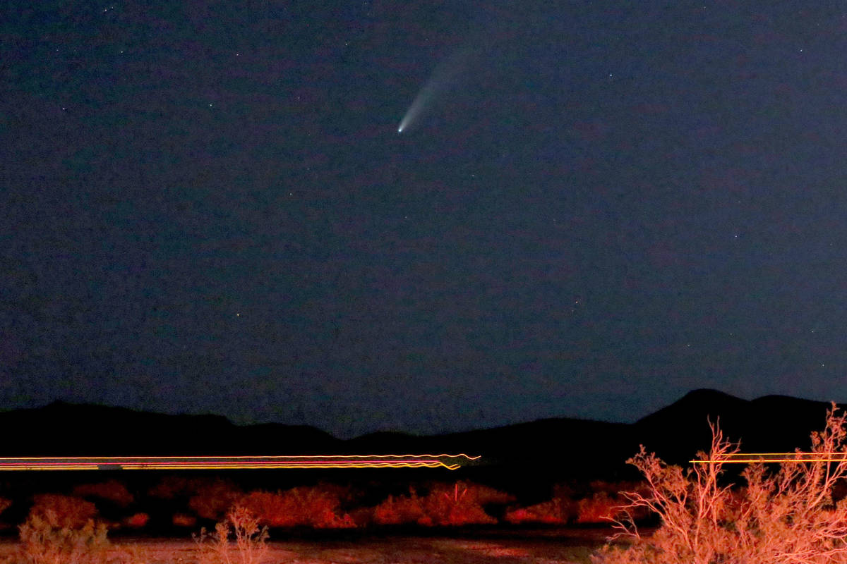 The 3-mile-wide Comet NEOWISE appears between just above the horizon and Interstate 15 in the e ...